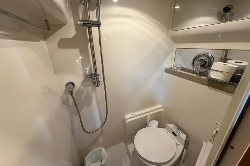 Slide: The Image of Compact bathroom in 2002 Regal Commodore 3860 yacht with shower and toilet. - 31