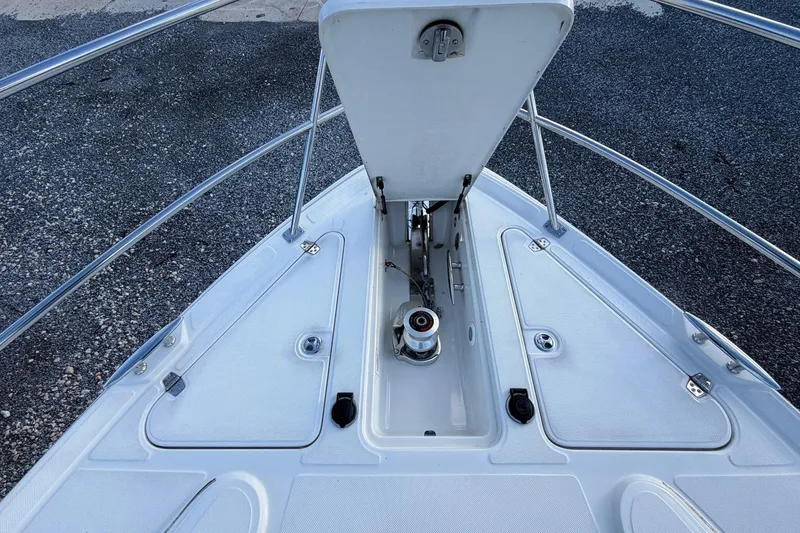 Slide: The Image of Bow of 2002 Regal Commodore 3860 yacht with anchor compartment open. - 18