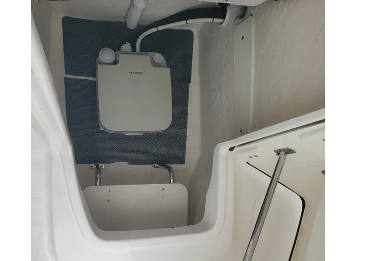 Slide: The Image of 2020 Robalo R222 Explorer boat interior with Dometic marine toilet. - 14