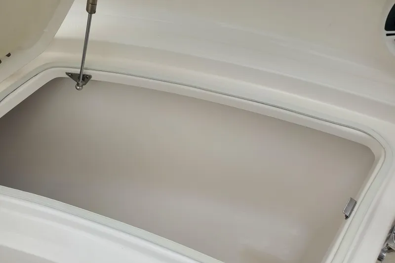 Slide: The Image of Open storage compartment on 2020 Robalo R222 Explorer boat. - 21