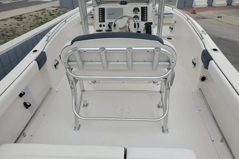 Slide: The Image of 2020 Robalo R222 Explorer boat interior with helm and seating area. - 6