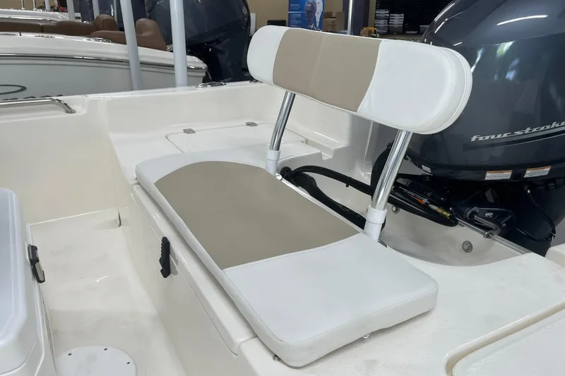 Slide: The Image of 2026 Bulls Bay 2000 boat interior with cushioned seating and four-stroke engine. - 10