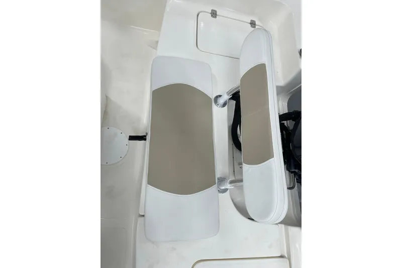 Slide: The Image of 2026 Bulls Bay 2000 boat interior with white and beige seating. - 16