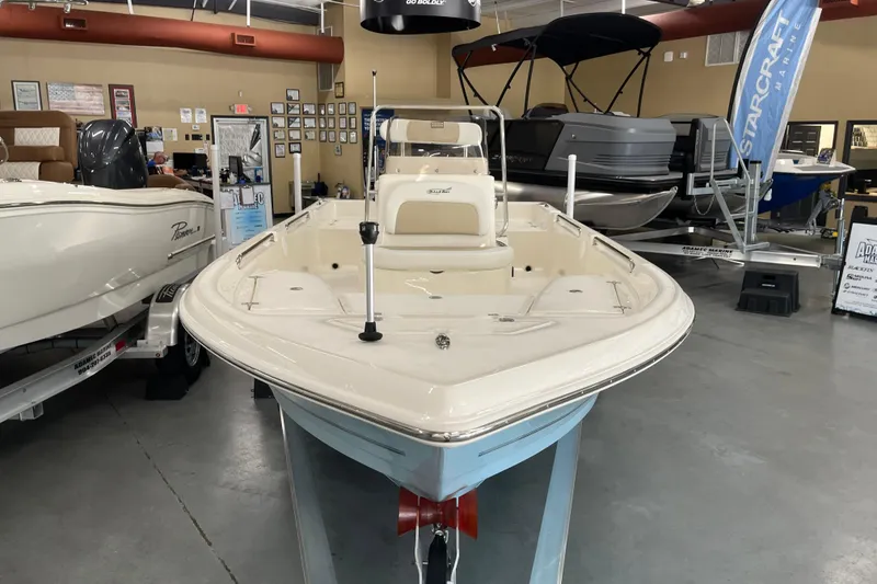 Slide: The Image of 2026 Bulls Bay 2000 boat displayed in a showroom with other boats. - 4
