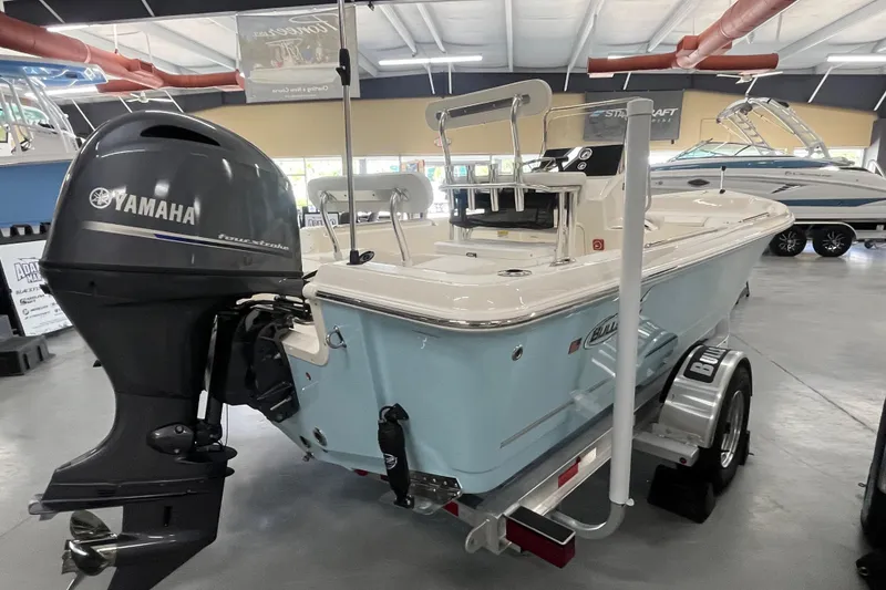 Slide: The Image of 2026 Bulls Bay 2000 boat with Yamaha outboard motor in showroom. - 6