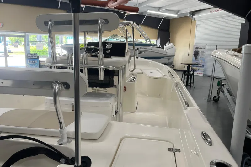 Slide: The Image of 2026 Bulls Bay 2000 boat interior in showroom, showcasing seating and helm features. - 9
