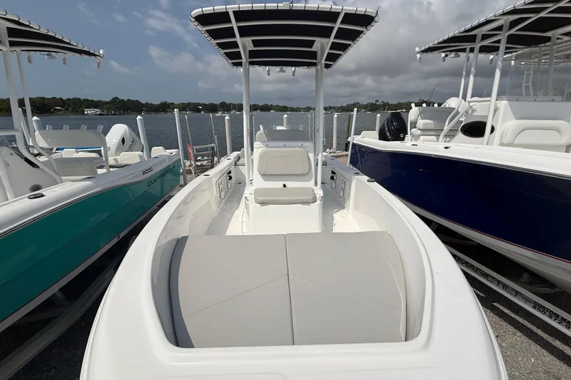 Slide: The Image of Clearwater 1900 Center Console boat, 2026 model, parked by the water. - 4