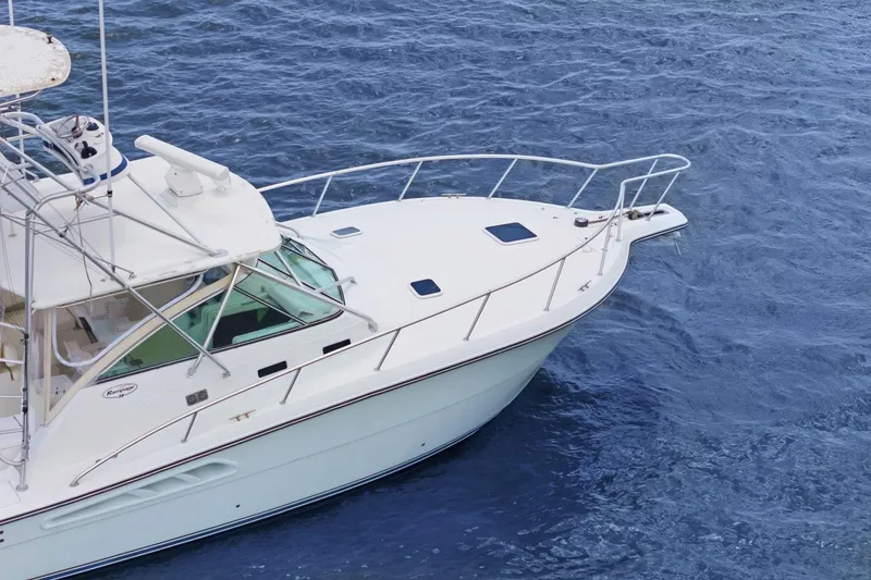 Slide: The Image of 2005 Rampage 38 Express boat on blue ocean water. - 13