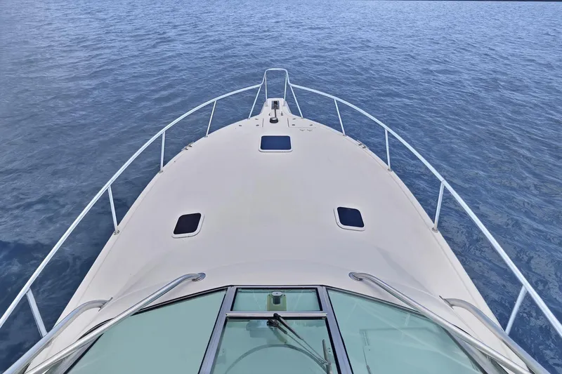 Slide: The Image of Bow view of 2005 Rampage 38 Express yacht on calm water. - 19