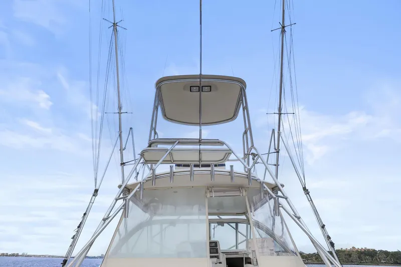 Slide: The Image of 2005 Rampage 38 Express boat with tower against blue sky background. - 21