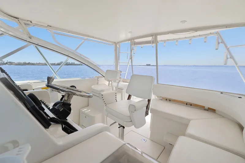 Slide: The Image of Interior view of 2005 Rampage 38 Express yacht helm with ocean backdrop. - 31