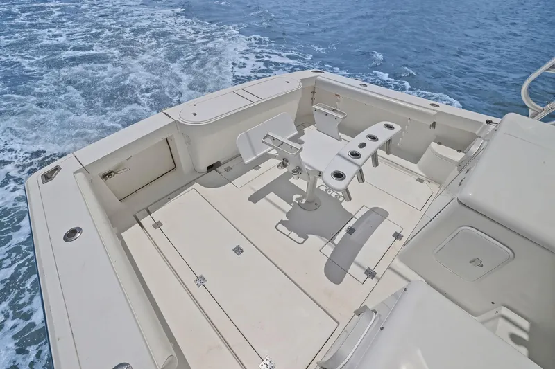 Slide: The Image of 2005 Rampage 38 Express boat deck with fishing chair and ocean view. - 34