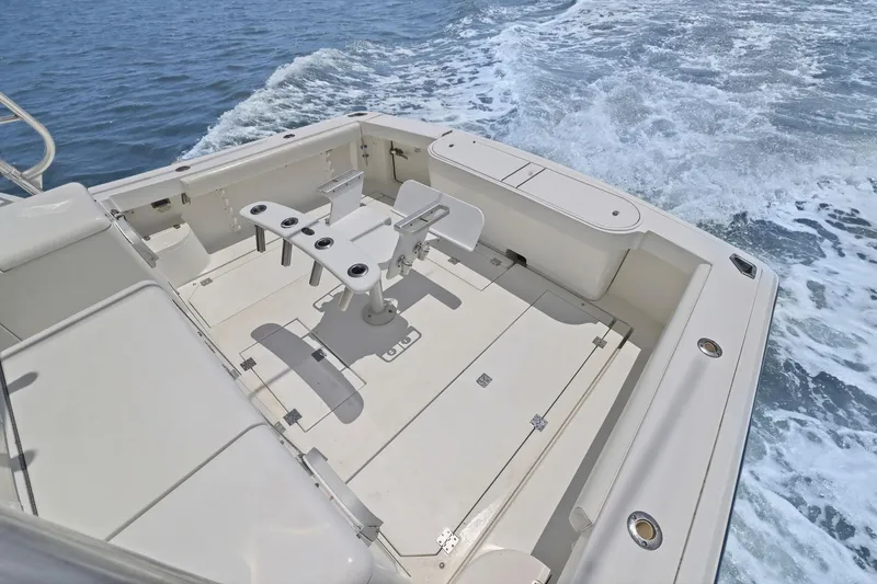 Slide: The Image of 2005 Rampage 38 Express boat deck with seating and ocean view. - 35