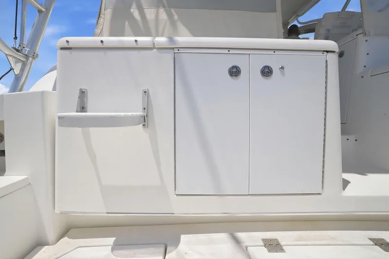 Slide: The Image of 2005 Rampage 38 Express boat interior storage compartment with white cabinetry. - 39
