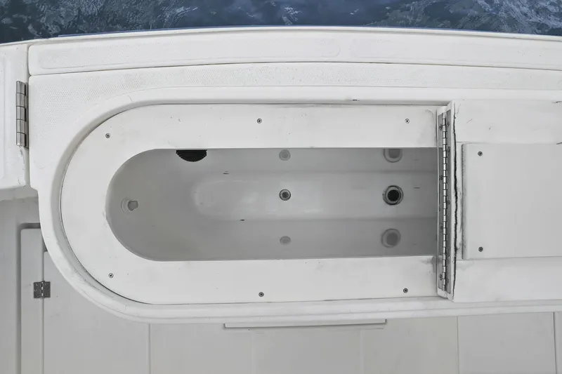 Slide: The Image of Open storage compartment on 2005 Rampage 38 Express boat deck. - 43