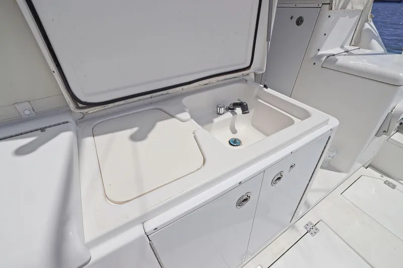 Slide: The Image of Outdoor sink on 2005 Rampage 38 Express yacht, featuring storage and sleek design. - 45