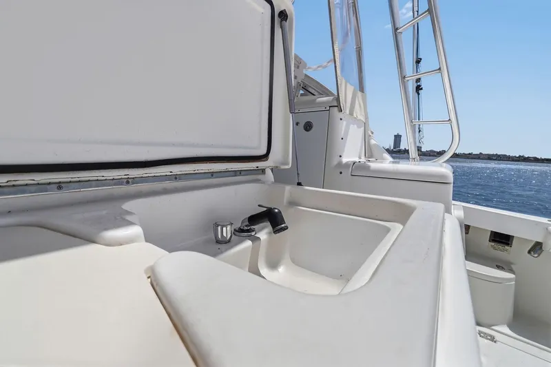 Slide: The Image of 2005 Rampage 38 Express boat sink area with ocean view. - 46