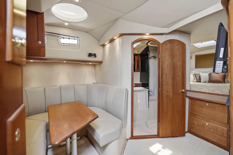Slide: The Image of Interior of 2005 Rampage 38 Express yacht with dining area, bathroom, and bedroom. - 50