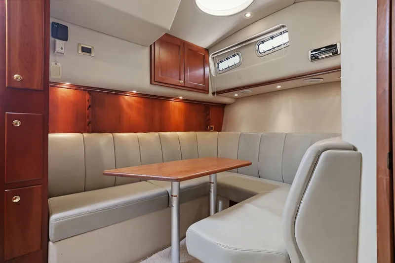 Slide: The Image of Luxurious interior of 2005 Rampage 38 Express yacht with elegant seating and wooden cabinetry. - 51