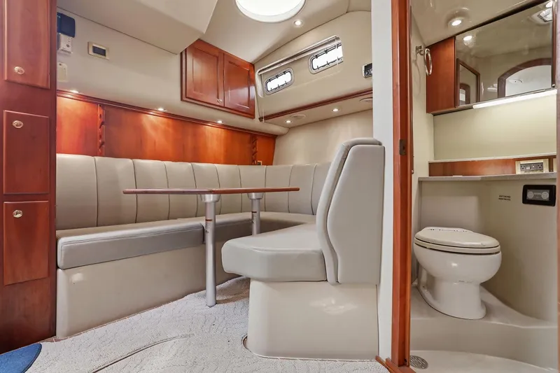 Slide: The Image of Luxurious interior of 2005 Rampage 38 Express yacht with seating and bathroom. - 52