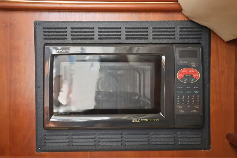 Slide: The Image of Built-in Sharp microwave in 2005 Rampage 38 Express boat kitchen. - 57