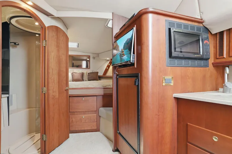Slide: The Image of Interior of 2005 Rampage 38 Express yacht with kitchenette, bed, and bathroom. - 59