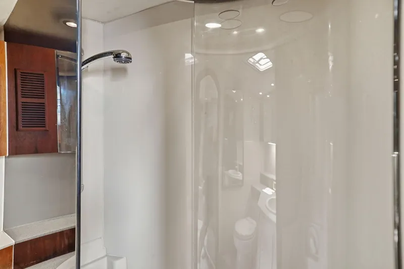 Slide: The Image of Bathroom interior of 2005 Rampage 38 Express yacht with shower and wooden cabinetry. - 64