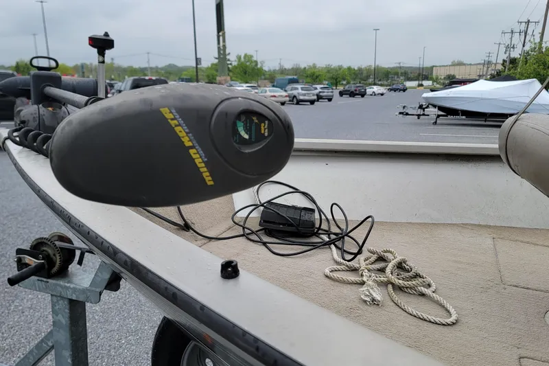 Slide: The Image of 2004 Tracker Pro Deep V-16 boat with Minn Kota trolling motor in parking lot. - 3