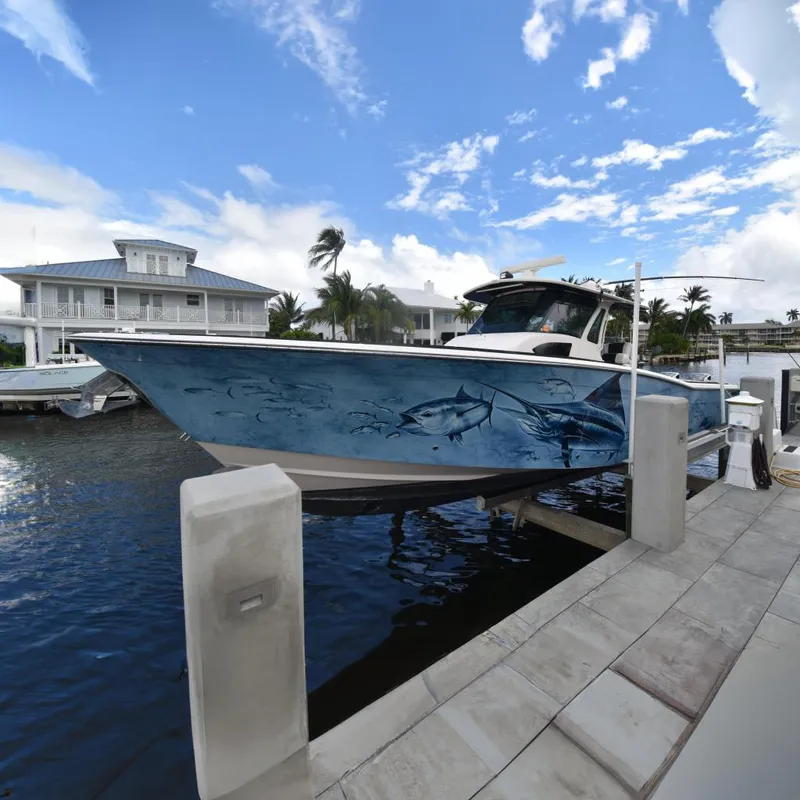The Image of 2010 Grady-White Canyon 366 boat docked with fish design. - 0