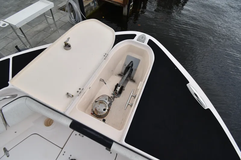 Slide: The Image of Open anchor compartment on 2010 Grady-White Canyon 366 boat at dockside. - 10