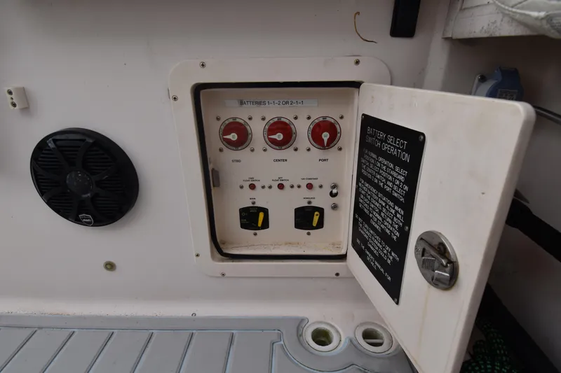 Slide: The Image of Control panel on a 2010 Grady-White Canyon 366 boat with battery switches. - 11