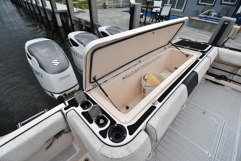 Slide: The Image of 2010 Grady-White Canyon 366 boat with Suzuki 350 engines and open storage compartment. - 14