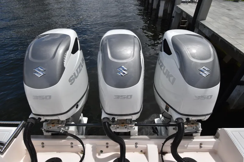 Slide: The Image of Triple Suzuki 350 outboard engines on a 2010 Grady-White Canyon 366 boat. - 16