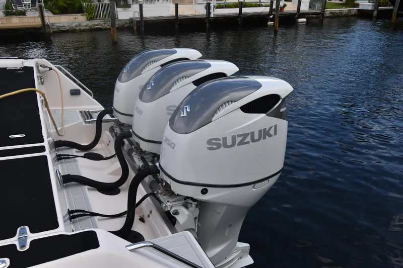 Slide: The Image of Triple Suzuki outboard engines on a 2010 Grady-White Canyon 366 boat. - 19