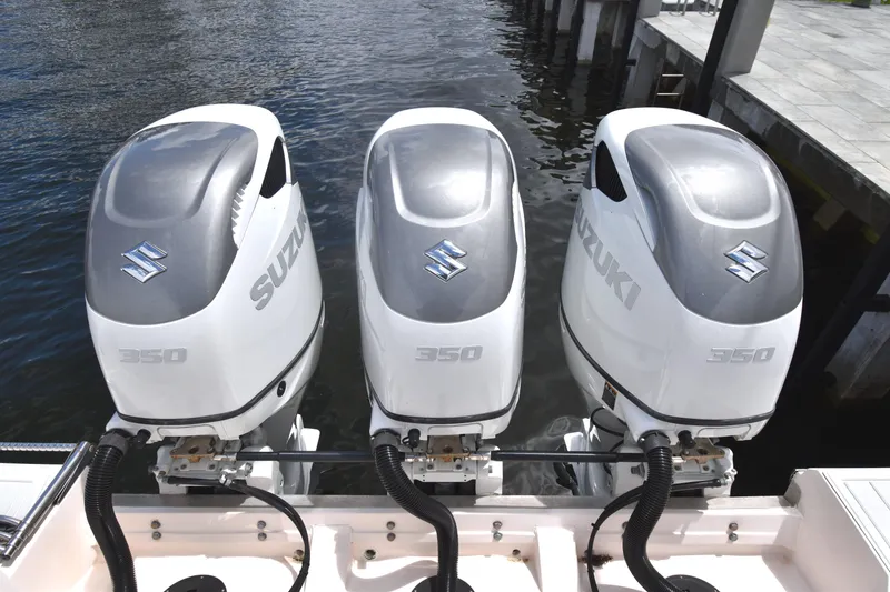 Slide: The Image of Triple Suzuki 350 outboard engines on a 2010 Grady-White Canyon 366 boat. - 27