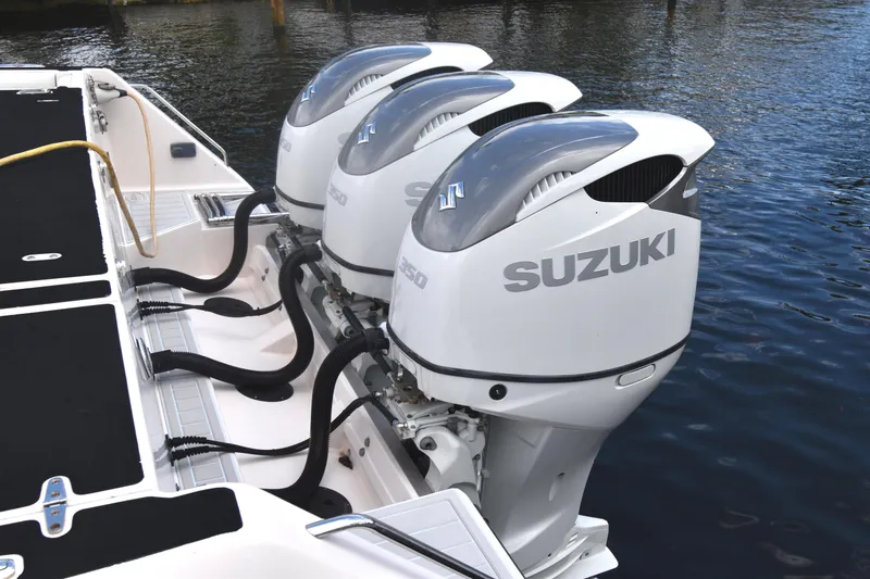 Slide: The Image of Triple Suzuki outboard engines on a 2010 Grady-White Canyon 366 boat. - 28