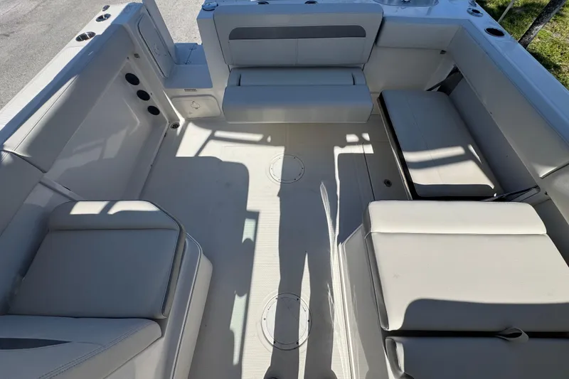 Slide: The Image of 2023 Sailfish 245 DC boat interior with spacious seating and modern design. - 4
