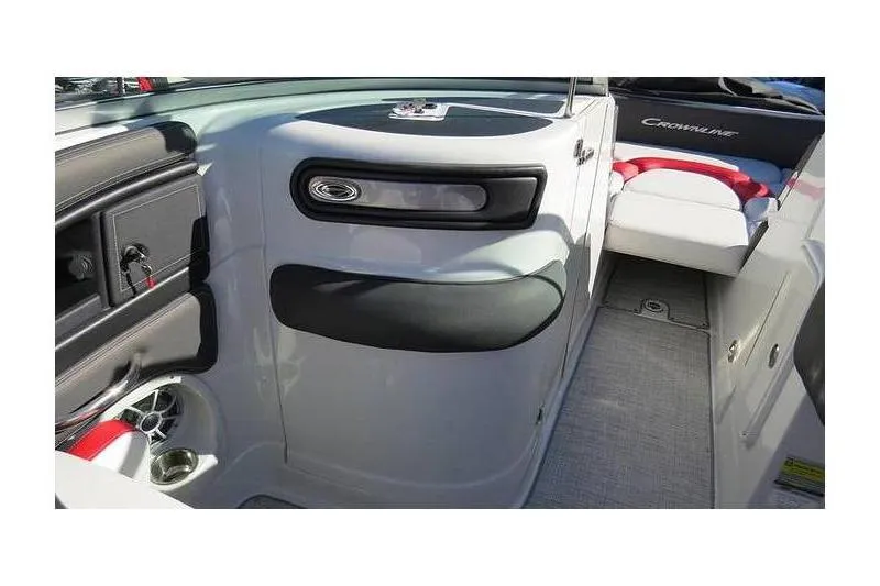 Slide: The Image of 2024 Crownline 250 XSS boat interior with sleek design and comfortable seating. - 11