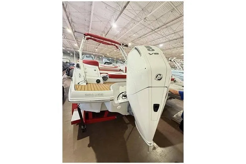 Slide: The Image of 2024 Crownline 250 XSS boat with powerful V8 engine, showcased indoors. - 3