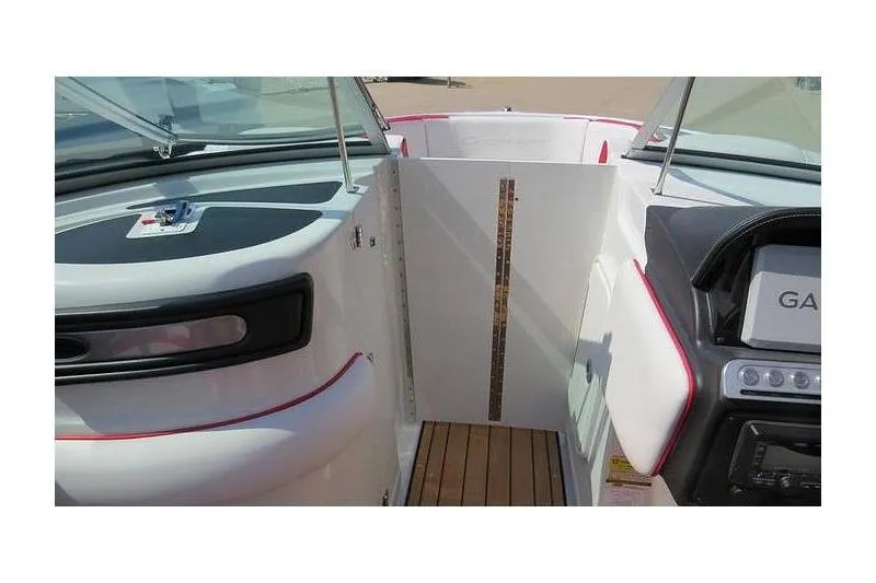 Slide: The Image of 2024 Crownline 250 XSS boat interior with open cockpit and wooden flooring. - 8