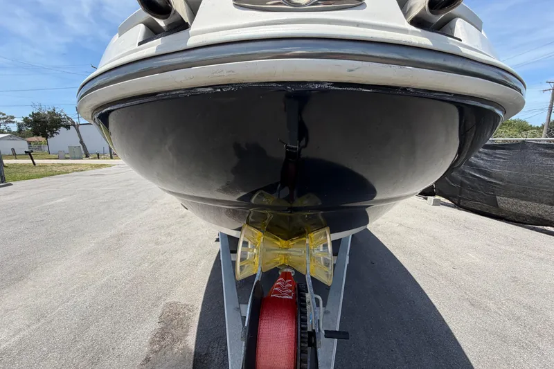 Slide: The Image of 2018 Stingray 204 LR boat on trailer, viewed from the front, outdoors. - 9