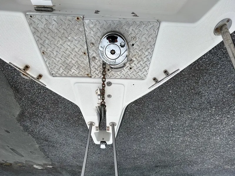 Slide: The Image of 1996 Robalo 2440 Walkaround boat anchor system with chain and metal plate. - 20
