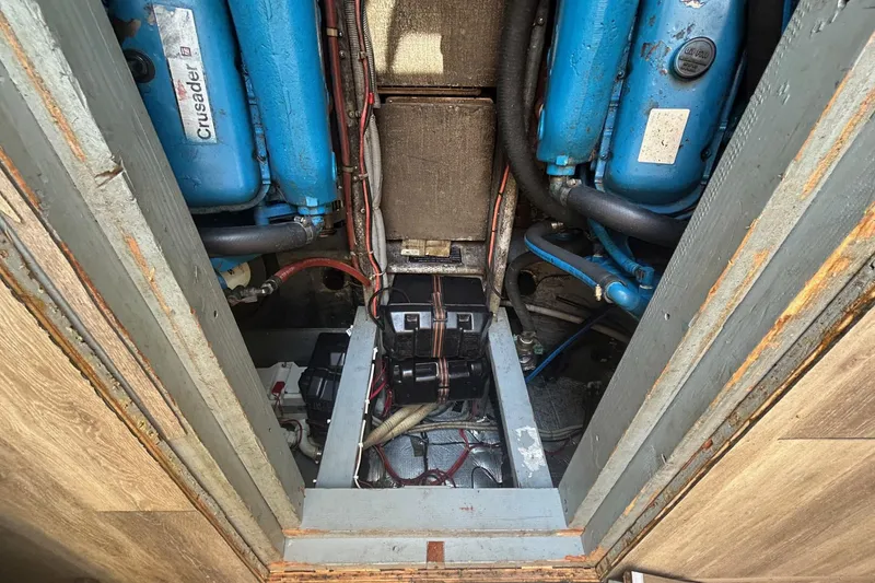 Slide: The Image of Engine compartment of a 1990 Silverton 34 Convertible boat, featuring Crusader engines. - 31