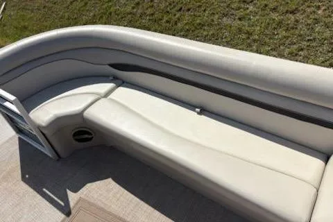 Slide: The Image of 2017 Bennington 22SLX boat interior with beige seating and sleek design. - 12