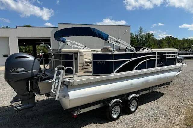 Slide: The Image of 2017 Bennington 22SLX pontoon boat with Yamaha motor on trailer, parked outdoors. - 4