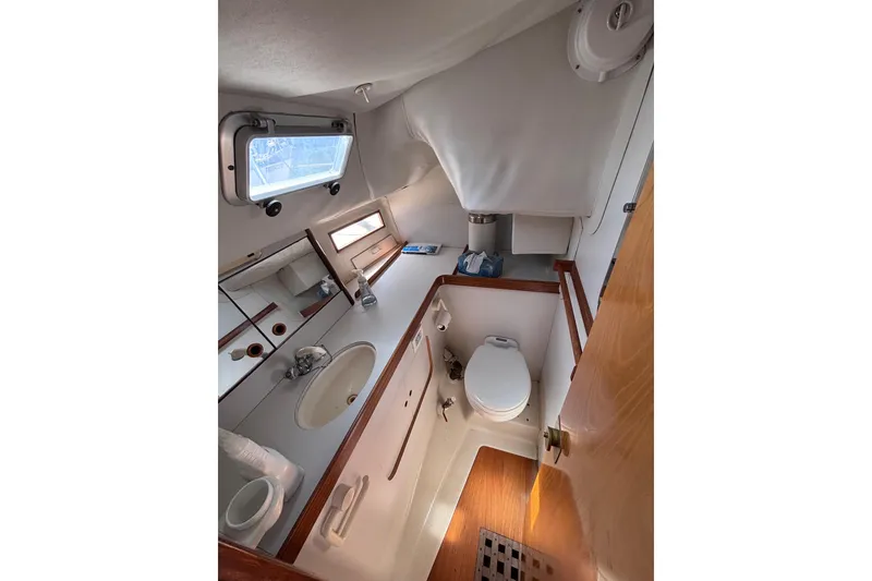 Slide: The Image of Interior view of 1990 Beneteau Oceanis 350 yacht bathroom with sink and toilet. - 12