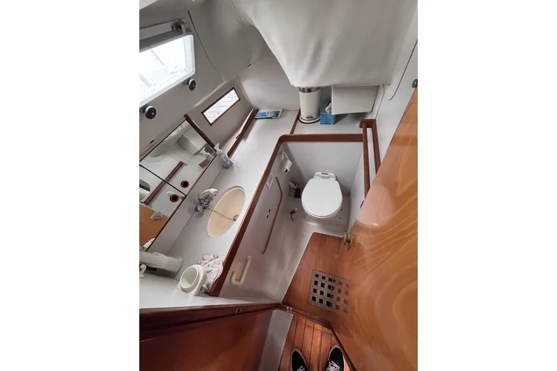 Slide: The Image of Interior view of 1990 Beneteau Oceanis 350 yacht bathroom with sink and toilet. - 17