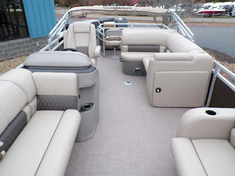 Slide: The Image of 2024 Sun Tracker SportFish™ 22 DLX pontoon boat with spacious seating and modern interior. - 15
