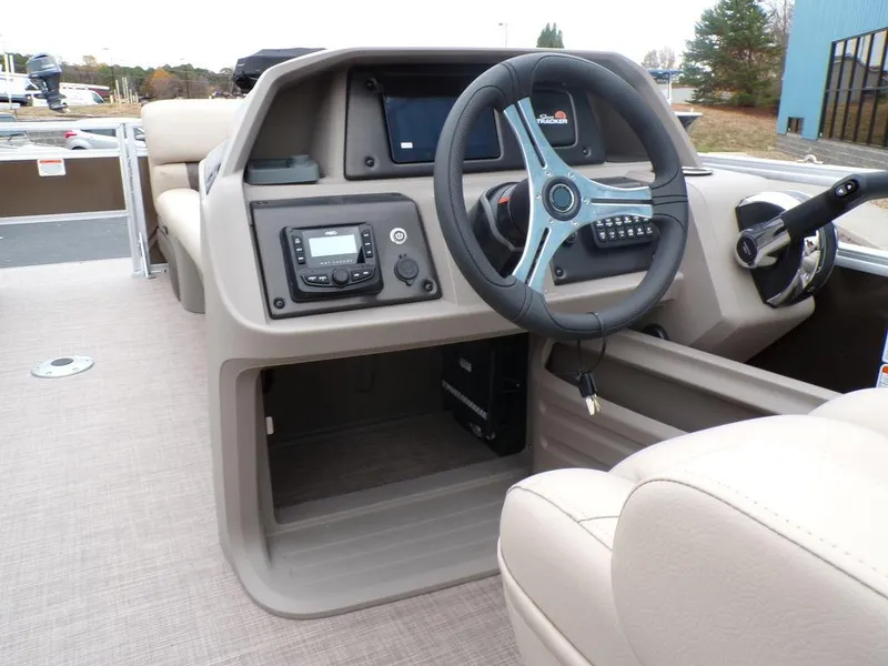 Slide: The Image of 2024 Sun Tracker SportFish™ 22 DLX boat console with steering wheel and controls. - 20