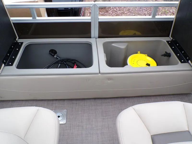 Slide: The Image of Sun Tracker SportFish™ 22 DLX 2024 boat storage compartments and seating area. - 22